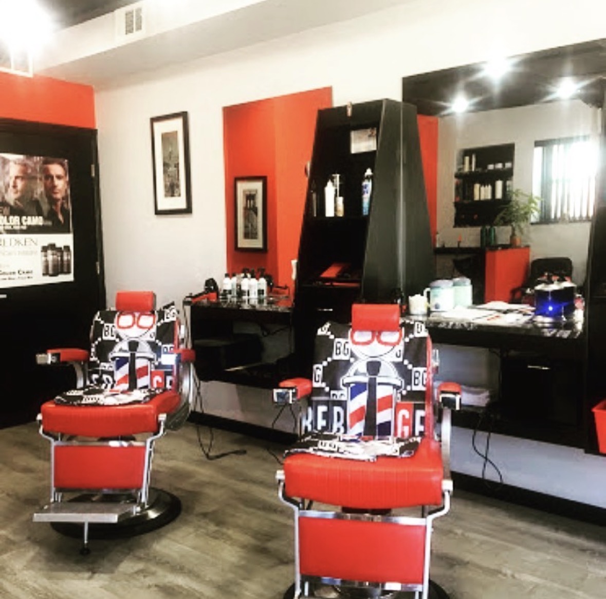 Ray's Barber Pole interior showing red and black themed barber chairs with decorative barber pole designs